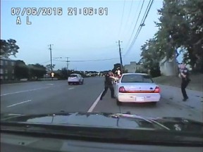 In this image made from July 6, 2016, video captured by a camera in the squad car of St. Anthony Police officer Jeronimo Yanez, the Minnesota police officer shoots at Philando Castile in the vehicle during a traffic stop in Falcon Heights, Minn. Yanez's backup officer Joseph Kauser is seen standing on the passenger side of the vehicle. The video was made public by the Minnesota Bureau of Criminal Apprehension and the Ramsey County Attorney's Office, Tuesday, June 20, 2017, just days after the officer was acquitted on all counts in the case. (St. Anthony Police department via AP)