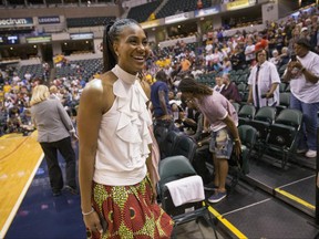 Former Indiana Fever great Tamika Catchings smiles Saturday, June 24, 2017, while attending the Fever's WNBA basketball game against the Los Angeles Sparks in Indianapolis. The Fever are retiring her No. 24 jersey Saturday. (Robert Scheer/The Indianapolis Star via AP)