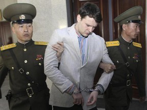 Otto Warmbier, center, is escorted at the Supreme Court in Pyongyang, North Korea in 2016