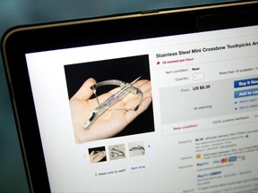 A listing by a Chinese seller on eBay's U.S. site for a miniature crossbow capable of firing toothpicks is seen on a computer screen in Beijing, Friday, June 23, 2017. Powerful mini-crossbows that shoot toothpicks and needles are the new must-have toy for schoolkids across China - and a nightmare for concerned parents and school officials. Several cities have reportedly banned sales of the palm-sized contraptions, which are powerful enough to puncture soda cans, apples and cardboard, depending on the projectile. (AP Photo/Mark Schiefelbein)