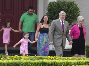 U.S. Ambassador to China Terry Branstad, second from right, walks with his wife Christine Branstad at right and other members of his family during a photocall and remarks to journalists at the Ambassador's residence in Beijing, China, Wednesday, June 28, 2017. A self-described "farm boy from Iowa" who's known China's president for more than 30 years, Terry made his first public appearance as the new U.S. ambassador in Beijing on Wednesday, assuming the post at a time when President Donald Trump has injected a strong dose of unpredictability into America foreign diplomacy.  (AP Photo/Ng Han Guan)
