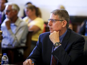 Hamilton County Assistant Prosecutor Seth Tieger listens to James Scanlon, (not seen) use of force expert, testify during Former University of Cincinnati police officer Raymond Tensing's retrial Friday, June 16, 2017, at the Hamilton County Courthouse in Cincinnati. Tensing is charged with murder and voluntary manslaughter in the shooting of unarmed black motorist Sam DuBose during a 2015 traffic stop. (Cara Owsley /The Cincinnati Enquirer via AP, Pool)