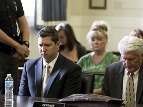 Former University of Cincinnati police officer Raymond Tensing, left, and his attorney Stew Mathews listen as Hamilton County Common Pleas Judge Leslie Ghiz tells the jury to continue deliberations after the jury said they are deadlocked during Tensing's trial on Friday, June 23, 2017 in Cincinnati.   Tensing is charged with murder and voluntary manslaughter in the shooting of unarmed black motorist Sam DuBose during a 2015 traffic stop. (Cara Owsley /The Cincinnati Enquirer via AP, Pool)