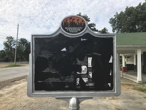 In this June 2017 photo, released by Allan Hammons, a civil rights historical marker in Money, Miss. is seen. The marker remembers black teenager Emmett Till, who was kidnapped before being lynched in 1955. Allan Hammons, whose public relations firm made the marker, said Monday that someone scratched the marker with a blunt tool in May.(Allan Hammons via AP)