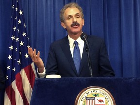 Los Angeles City Attorney Mike Feuer talks during a news conference on Tuesday, June 20, 2017, in Los Angeles. Authorities say a Los Angeles man accused of trafficking cocaine out of his house did so while running an unlicensed day care center. A federal criminal complaint filed this month says 48-year-old Felipe Talamante tried to sell cocaine to an undercover agent. When the men met to make the sale in May, the agent noticed that children were playing in the home's front yard. (AP Photo/Christopher Weber)