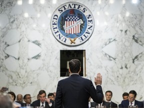 James Comey is sworn in to a Senate Intelligence Committee hearing in Washington, D.C., U.S., on Thursday, June 8, 2017