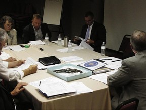 A recently obtained pistol from the Civil War era is shown to members of the South Carolina Confederate Relic Room and Military Museum Board at a meeting on Thursday, June 22, 2017 in Columbia, South Carolina. The board briefly discussed South Carolina's last Confederate flag, taken down in July 2015, which the museum has received no money from lawmakers to display and remains in a special box deep in the museum's storage. (AP Photo/Jeffrey Collins)