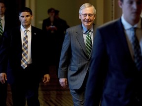 Senate Majority Leader Mitch McConnell of Ky. arrives on Capitol Hill in Washington, Thursday, June 22, 2017, as Senate Republicans work on a health reform bill. Senate Republicans would cut Medicaid, end penalties for people not buying insurance and erase a raft of tax increases as part of their long-awaited plan to scuttle Barack Obama's health care law. (AP Photo/Andrew Harnik)