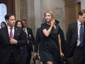 Ivanka Trump, daughter of President Donald Trump who also serves as an adviser, is escorted by Sen. Marco Rubio, R-Fla., as she arrives at the Capitol to meet with lawmakers about parental leave, in Washington