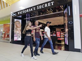In this Wednesday, June 7, 2017, photo, shoppers walk by a Victoria's Secret store, in Hialeah, Fla. On Tuesday, June 27, 2017, the Conference Board releases its June index on U.S. consumer confidence.  (AP Photo/Alan Diaz)