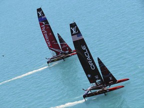 CORRECTS TO SUNDAY, JUNE 25 - In this photo provided by America's Cup Event Authority, Emirates Team New Zealand, top, competes against Oracle Team USA during the America's Cup sailing competition in the Great Sound of Bermuda, Sunday, June 25, 2017. (Gilles Martin-Raget/ACEA via AP)