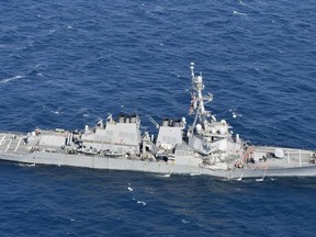 CORRECTS DATE  - The USS Fitzgerald is seen off Shimoda, Shizuoka prefecture, Japan, after the Navy destroyer collided with a merchant ship, Saturday,  June 17, 2017.  The U.S. Navy says the USS Fitzgerald suffered damage below the water line on its starboard side after it collided with a Philippine-flagged merchant ship.  (Iori Sagisawa/Kyodo News via AP)