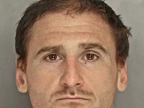 This photo provided by the Pennsylvania Attorney General's Office shows Michael Marchalk, charged with murder in the death of his father Gary Marchalk. Pennsylvania State Police say in a complaint filed Wednesday, June 21, 2017, that Gary Marchalk, an attorney found dead in the home of his estranged wife Linda Marchalk, treasurer of Schuylkill County, Pa., was fatally beaten with a bat by his son Michael Marchalk on Father's Day, Sunday, June 18, 2017. Authorities were still searching Thursday, June 22, 2017, for Michael Marchalk, last seen at a Philadelphia bus terminal. (Pennsylvania Attorney General's Office via AP)