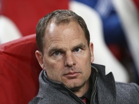 FILE - In this Thursday, Feb. 19, 2015 file photo, Ajax's head coach Frank de Boer watches his players line up during the first leg of the round of 32 Europa League match between Ajax and Legia Warsaw, at ArenA stadium in Amsterdam, Netherlands. Crystal Palace will hold a news conference on Monday June 26, 2017 to announce its new manager. British media are reporting that the Premier League club will hire former Netherlands defender Frank De Boer. (AP Photo/Peter Dejong, File)