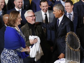FILE - This Jan. 16, 2017 file photo shows then-President Barack Obama talking with Cubs manager Joe Maddon, center, and co-owner Laura Ricketts, left, during a ceremony in the East Room of the White House in Washington, where the president honored the 2016 World Series Champion baseball team. Maddon and some members of the Chicago Cubs will visit the White House on Wednesday, June 28, 2017 though it's not an official visit with President Donald Trump. (AP Photo/Pablo Martinez Monsivais)