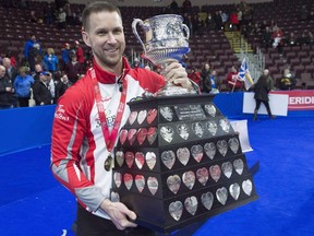 In this March 12 file photo, Brad Gushue holds the Brier Tankard after winning the Tim Hortons Brier.