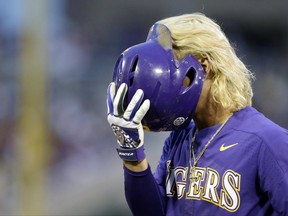 LSU's Kramer Robertson reacts after being thrown out at first base to end the top of the fifth inning against Florida in Game 2 of the NCAA College World Series baseball finals in Omaha, Neb., Tuesday, June 27, 2017. (AP Photo/Nati Harnik)