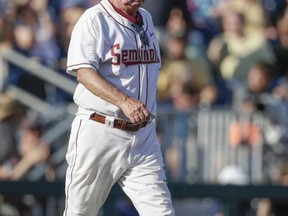 Florida State coach Mike Martin walks to the mound to talk to pitcher Cole Sands during the second inning of the team's NCAA College World Series baseball game against LSU in Omaha, Neb., Wednesday, June 21, 2017. (AP Photo/Nati Harnik)