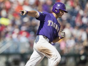 LSU's Josh Smith rounds the bases after he hit a solo home run in the seventh inning of an NCAA College World Series baseball game against Oregon State in Omaha, Neb., Friday, June 23, 2017. (Matt Dixon/Omaha World-Herald via AP)