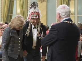 Governor General David Johnston acknowledges Wilton Littlechild and Marie Wilson before presenting them with the Meritorious Service Cross during a ceremony at Rideau Hall, Monday, June 19, 2017 in Ottawa.