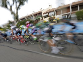 FILE - This Sunday, July 19, 2015 photo made with a slow shutter speed shows riders during the fifteenth stage of the Tour de France cycling race in Valence, France. In a study published Thursday, June 29, 2017, researchers have found that EPO, a common doping agent in competitive cycling, does not improve times in a simulated Tour de France-style mountain climb. (AP Photo/Christophe Ena)