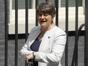 Leader of Northern Ireland's Democratic Unionist Party (DUP) Arlene Foster looks at her watch as she arrives at 10 Downing Street in London, for a meeting with Britain's Prime Minister Theresa May, Tuesday June 13, 2017.