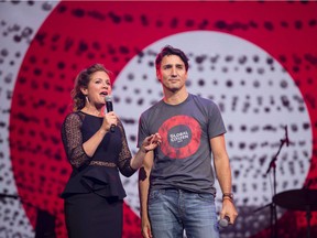 Prime Minister Justin Trudeau looks on as his wife Sophie Gregoire Trudeau speaks during the Global Citizen Concert to End AIDS, Tuberculosis and Malaria in Montreal, Quebec, September 17, 2016.