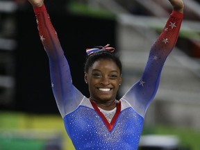 Tennis star Serena Williams and gymnast Simone Biles are two of the finalists for best female athlete. (AP Photo/Rebecca Blackwell, File)