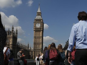 FILE - In this May 25, 2017 file photo, people observe a minute of silence in Westminster in London, after the suicide attack at an Ariana Grande concert that left more than 20 people dead and many more injuredat the Manchester Arena. The jihadis' targets are depressingly repetitive: the Brussels metro (twice), Paris' Champs-Elysees (twice) and tourist-filled bridges in London (twice). And that's just the past few months. (AP Photo/Kirsty Wigglesworth, File)