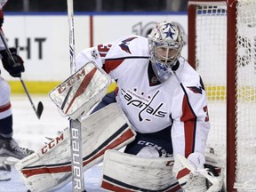 FILE - In this Sunday, Feb. 19, 2017, file photo, Washington Capitals goalie Philipp Grubauer defends the net during the second period of an NHL hockey game against the New York Rangers in New York. The Vegas Golden Knights GM might as well be The Godfather of the NHL during a three-day expansion draft window. The expansion draft rules made it so that Vegas would wind up with strong enough goaltending to be competitive even in its inaugural season. There's also a surplus of young goaltending talent, including Detroit's Petr Mrazek, Washington's Grubauer, the New York Rangers' Antti Raanta and Colorado's Calvin Pickard. (AP Photo/Seth Wenig, File)