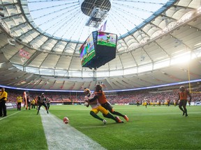 B.C. Lions DB Anthony Thompson prevents Edmonton Eskimos WR Adarius Bowman from making a catch on June 24.