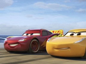 This image released by Disney shows Lightning McQueen, voiced by Owen Wilson, left, and Cruz Ramirez, voiced by Cristela Alonzo in a scene from "Cars 3." (Disney-Pixar via AP)