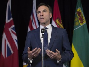 Minister of Finance Bill Morneau speaks with the media following meetings with his provincial counterparts in Ottawa, Monday June 19, 2017. THE CANADIAN PRESS/Adrian Wyld