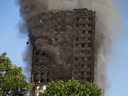 Smoke billows from Grenfell Tower as firefighters attempt to control a huge blaze on June 14, 2017 in west London.