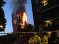 Fire engulfs the Grenfell Tower early June 14, 2017 in west London.