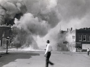 This June 27, 1931, photo provided by Clay County Heritage shows a fire in Spencer, Iowa, after a dropped sparkler ignited an inferno that roared through much of the small city. The fire led to a statewide fireworks ban that endured for generations. Decades later, with fireworks legal in most of the country and amid calls by lawmakers for "fun, freedom and fireworks," the Iowa Legislature this year ended one of the nation's oldest bans. (Clay County Heritage via AP)