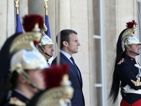 France's President Emmanuel Macron waits prior to meet the President of Guatemala Jimmy Morales, at the Elysee Palace, in Paris.