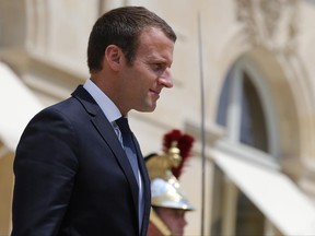 France's President Emmanuel Macron arrives to welcome Crown Prince of Abu Dhabi and Deputy Supreme Commander of the UAE Armed Forces Sheikh Mohammed bin Zayed al-Nahayan, prior to a meeting, at the Elysee Palace, in Paris, Wednesday, June 21, 2017. (AP Photo/Thibault Camus)