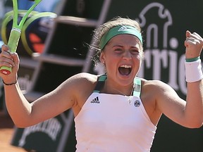 Jelena Ostapenko celebrates her win over Timea Bacsinszky at the French Open on June 8.