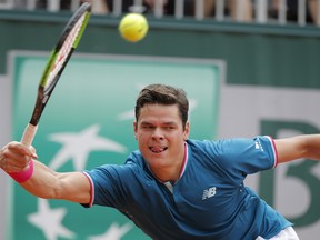 Canada's Milos Raonic plays a shot against Spain's Guillermo Garcia-Lopez during their third round match of the French Open tennis tournament at the Roland Garros stadium, in Paris, France. Friday, June 2, 2017.