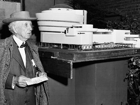 n this Oct. 25, 1953 file photo, architect Frank Lloyd Wright stands next to a model of the new building he designed for the Solomon R. Guggenheim Museum in New York.