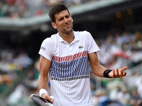 Serbia's Novak Djokovic reacts after a point against Argentina's Diego Schwartzman during their tennis match at the Roland Garros 2017 French Open on June 2, 2017 in Paris.