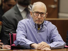 FILE - In this Dec. 21, 2016, file photo, millionaire real estate heir Robert Durst sits in a courtroom during a hearing in Los Angeles.  Durst's longtime friends are fighting in a New York court to avoid being sent to testify in California in a pretrial hearing in the millionaire's murder case. The Los Angeles district attorney says Stewart and Emily Altman could provide information about Durst's state of mind. Durst denies allegations he killed one of his closest friends, Susan Berman in 2000.   (AP Photo/Jae C. Hong, Pool, File)