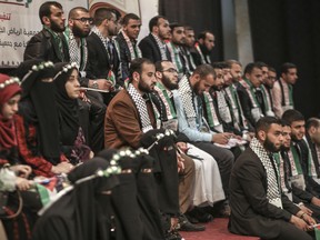 Palestinian couples at a Hamas ceremony organized by Al-Tayseer Society for Marriage and Development in Gaza City. Hamas has been trying to encourage marriage by paying the equivalent of $1,500 to any male who memorizes the Quran.