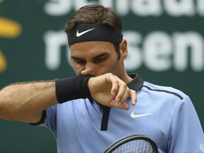 Switzerland's Roger Federer  competes during the match against  Russia's Karen Khachanov  at the Gerry Weber Open tennis tournament in Halle, Germany, Saturday, June 24, 2017. (Friso Gentsch/dpa via AP)