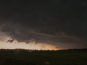 Dark clouds obscure the sky above  Elbstorf, Germany, Thursday, June 22, 2017.  (Philipp Schulze/dpa via AP)