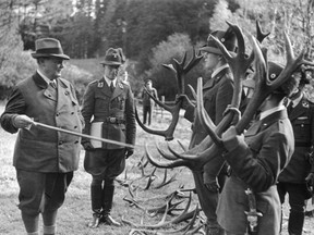 Hermann Goering inspecting antlers following a hunting trip. It was Goering's interest in hunting and forestry that would prompt him to patronize a scheme to restore a depopulated Europe to its prehistoric state.