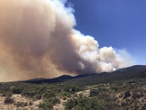Smoke billows from a wildfire locally called Goodwin Fire, near Prescott, Ariz., Tuesday, June 27, 2017. More than 500 firefighters braced for windy conditions Tuesday as they continued to battle the northern Arizona wildfire that has burned 6.8 square miles (17.6 sq. kilometers) so far. (Les Stukenberg/The Daily Courier via AP)