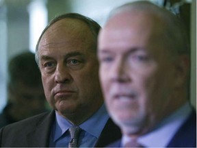 B.C. Green party leader Andrew Weaver and B.C. NDP leader John Horgan speak to media after announcing they'll be working together to help form a minority government during a press conference at Legislature in Victoria, B.C., on Monday, May 29, 2017.