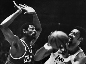 In this May 5, 1969 photo, Los Angeles Lakers' Wilt Chamberlain tries to shoot against Boston Celtics' Bill Russell during an NBA basketball finals game at the Forum in Inglewood, Calif. Chamberlain and Russell went head-to-head 142 times over a decade from 1959-1969.